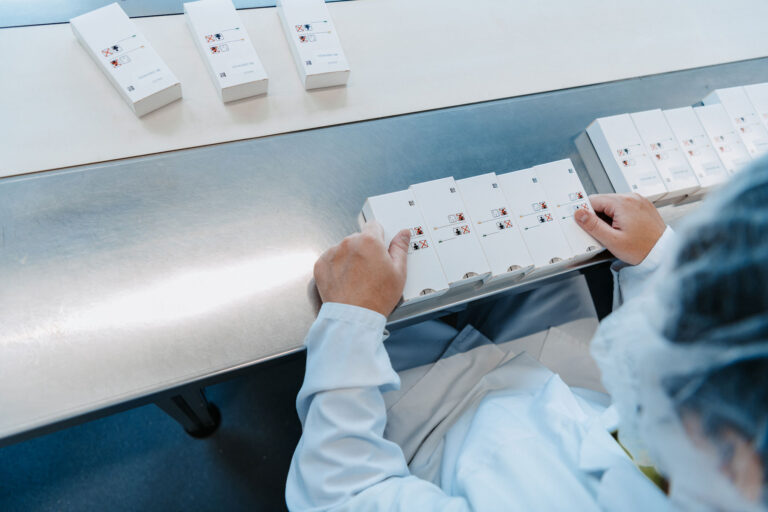 Packaging is checked on the conveyor belt.